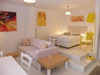 A bed or beds in a room at Koumaros Aparthotel