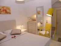 A bed or beds in a room at Koumaros Aparthotel