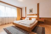 A bed or beds in a room at Landhaus Kreuz