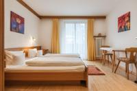 A bed or beds in a room at Landhaus Kreuz