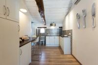 A kitchen or kitchenette at La Casa de la Vieja - Rustic & Charming Appartments