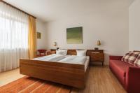 A bed or beds in a room at Landhaus Kreuz