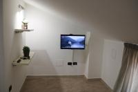 A television and/or entertainment centre at Amira Luxury Apartments
