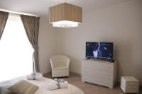 A television and/or entertainment centre at Amira Luxury Apartments