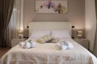 A bed or beds in a room at Amira Luxury Apartments