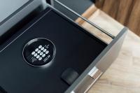 a black box with a remote control in it at Entourage sur-le-Lac in Lac-Beauport