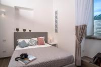 Posteľ alebo postele v izbe v ubytovaní Metahome Sorrento