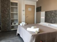 Posteľ alebo postele v izbe v ubytovaní Hotel Kim