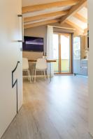 A television and/or entertainment centre at La Giostra Home Apartments
