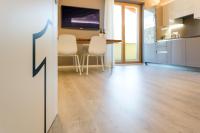 A kitchen or kitchenette at La Giostra Home Apartments
