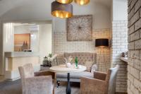 a living room with a table and chairs at Hotel Florenc in Prague