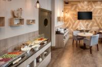a buffet line with a table and a dining room at Hotel Florenc in Prague