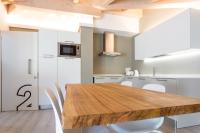 A kitchen or kitchenette at La Giostra Home Apartments