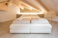A bed or beds in a room at La Giostra Home Apartments