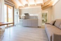A kitchen or kitchenette at La Giostra Home Apartments
