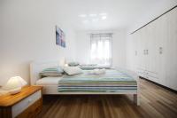 Posteľ alebo postele v izbe v ubytovaní Apartman Dendo