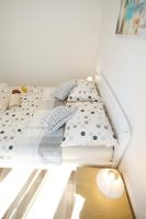 Posteľ alebo postele v izbe v ubytovaní Apartman Dendo