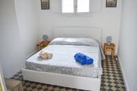 A bed or beds in a room at Sofia Pretty Appartament