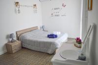 A bed or beds in a room at Sofia Pretty Appartament