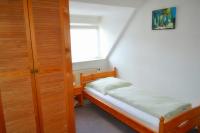 a small bedroom with a bed and a window at Hotel Hohenstein -Radweg-Messe-Baldeneysee in Essen