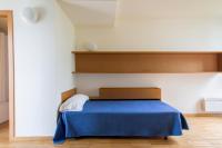 A bed or beds in a room at Residencia Universitaria Resa O Castro