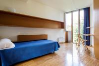 A bed or beds in a room at Residencia Universitaria Resa O Castro