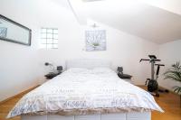 Postel nebo postele na pokoji v ubytování Roko Apartments