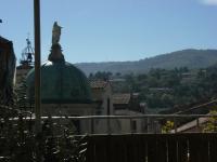 a view of a building with a green dome at L&#39;Auberge Espagnole - Bed &amp; Breakfast in Apt