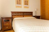 A bed or beds in a room at Apartamentos Tres Luces