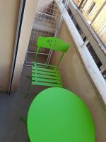a green table and a green chair in a room at le mauritania in Sainte-Maxime