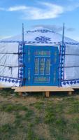 a blue and white yurt sitting in a field at Yurte in Langa in Bosia