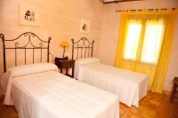 Postel nebo postele na pokoji v ubytování Casas Rurales Cortijo Bellavista