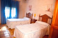 Postel nebo postele na pokoji v ubytování Casas Rurales Cortijo Bellavista