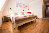 Posteľ alebo postele v izbe v ubytovaní Harmónia Hotel Sárvár