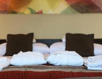 Posteľ alebo postele v izbe v ubytovaní Harmónia Hotel Sárvár