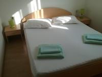 Postel nebo postele na pokoji v ubytování Apartmani PISAC
