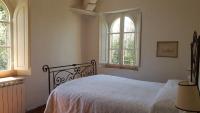 Posteľ alebo postele v izbe v ubytovaní villa montalcino palazzina castelverdelli