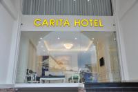 Carita Hotelに飾ってある許可証、賞状、看板またはその他の書類