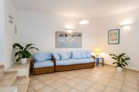 A seating area at Apartment in S'Abba e Sa Pedra with pool
