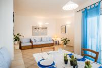 A seating area at Apartment in S'Abba e Sa Pedra with pool