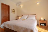 Posteľ alebo postele v izbe v ubytovaní Apartments Villa Marnii