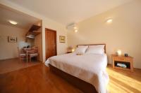 Posteľ alebo postele v izbe v ubytovaní Apartments Villa Marnii