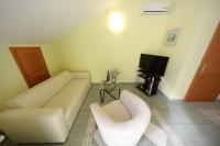 Televízia a/alebo spoločenská miestnosť v ubytovaní Apartments Villa Marnii