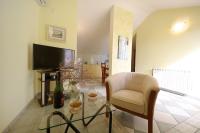 Televízia a/alebo spoločenská miestnosť v ubytovaní Apartments Villa Marnii