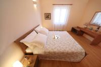 Posteľ alebo postele v izbe v ubytovaní Apartments Villa Marnii