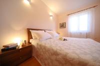 Posteľ alebo postele v izbe v ubytovaní Apartments Villa Marnii