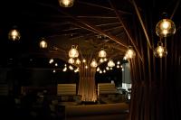 a room with chandeliers and tables and chairs at Ceiba Hotel Bissau in Bissau