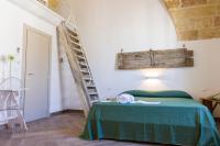 Posteľ alebo postele v izbe v ubytovaní Il Cortile dei Nonni