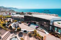 an aerial view of a building next to the ocean at DWO Mira Palace in Al Hoceïma