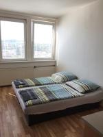A bed or beds in a room at Šariš rooms